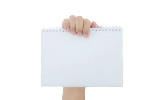 Hand holding an empty notepad (notebook) isolated on white background Foto stock