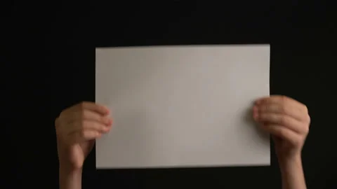 Hand holding empty paper Stock Footage 107789371