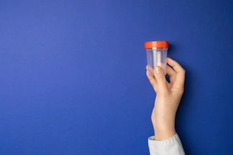 Hand holding empty plastic container Stock Photos