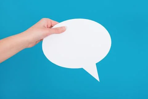 Hand holding an empty speech bubble Stock Photos