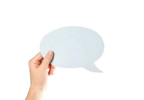 Hand holding an empty speech bubble. Close up. Isolated on white background Fotos Stock