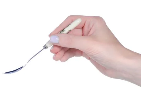 Hand holding empty teaspoon Stock Photos