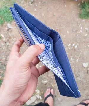 Hand holding empty wallet Stock Photos
