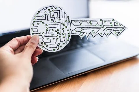Hand holding encryption key icon made of circuits and LED lights in front of  Foto stock