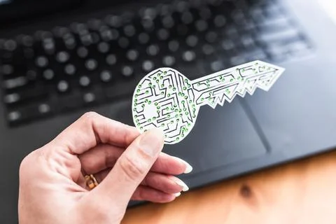 Hand holding encryption key icon made of circuits and LED lights in front o.. Foto stock