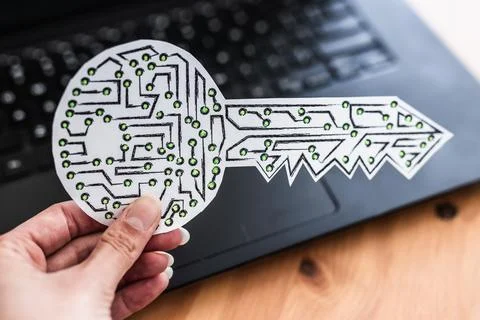 Hand holding encryption key icon made of circuits and LED lights in front o.. 写真素材