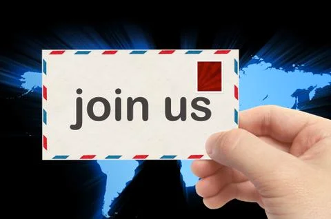 Hand holding envelope with join us word and world background Foto stock