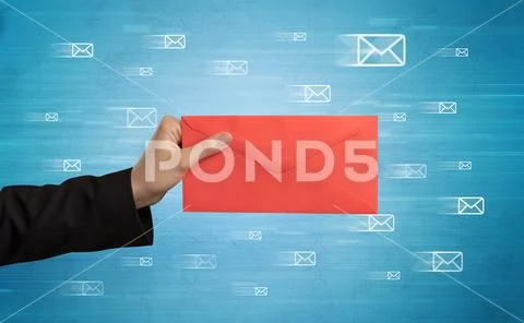 Hand holding envelope with message symbols around Stock Photos