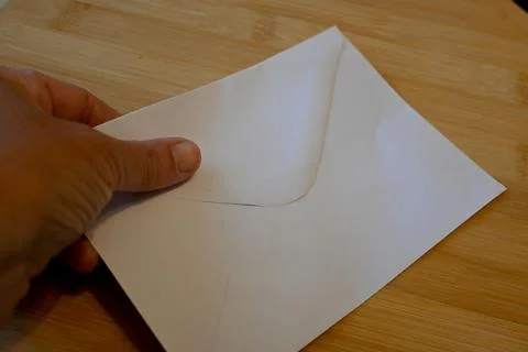 Hand holding envelope payment concept 库存照片