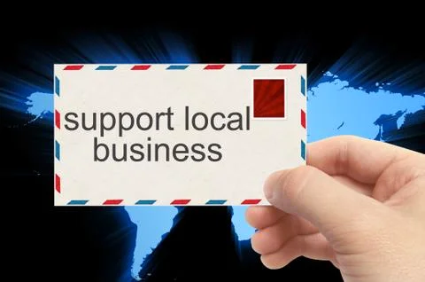 Hand holding envelope with support local business word on world background Stock Photos