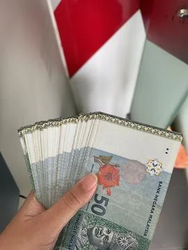 Hand Holding a Fan of Malaysian Ringgit RM50 Banknotes Stock Photos