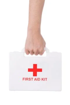 Hand holding a first aid kit isolated on white background. Stock Photos