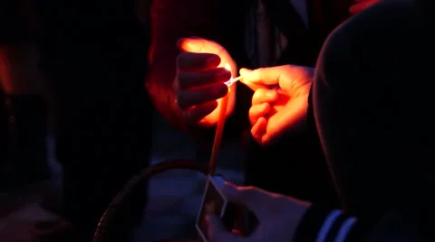 The hand holding the flame of the candle at the Easter cake. Video stock 49129526