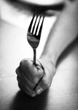 Hand holding fork, close-up, b&amp;w Stock Photos
