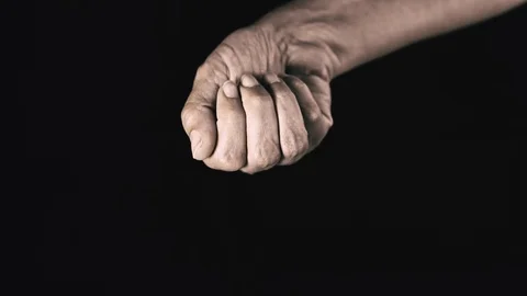 Hand Holding Fresh Coffee Beans, Slow Motion clip on Black Background Stockbeeldmateriaal 107168761