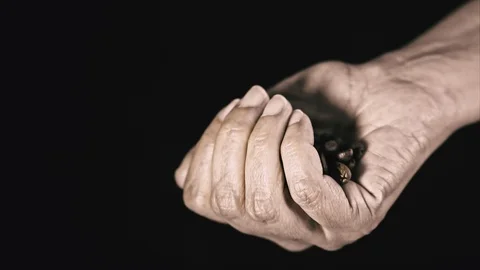 Hand Holding Fresh Coffee Beans, Slow Motion clip on Black Background Stock Footage 107168798