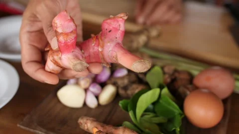 Hand Holding Galangal Root, HD Video stock 148192166