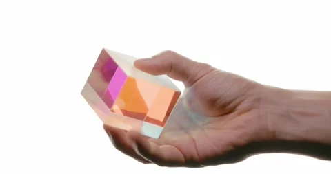 Hand Holding a Glass Cube with Rainbow Refraction Stock Footage 293677028
