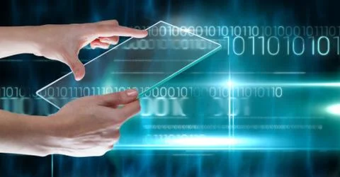 Hand holding glass tablet with binary code technology Stock Photos