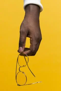 Hand holding glasses Stock Photos