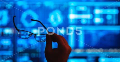 The hand holding glasses on the screen background Stock Photos
