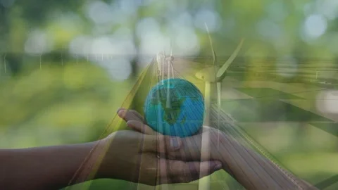 Hand holding globe over wind turbines, symbolizing earth care. Stock Footage 336479268