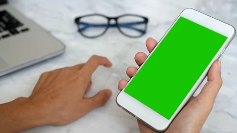 Hand holding green screen Stock Footage 87671267