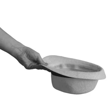 Hand holding a hat on a white background Stock Photos