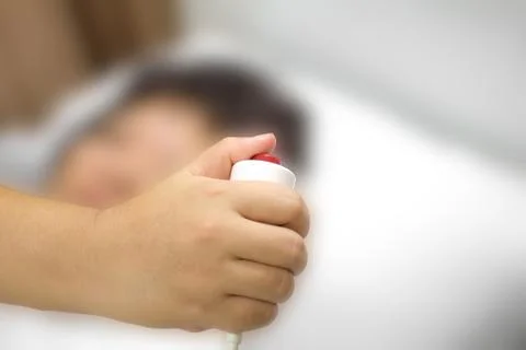 Hand holding a help call button emergency Stock Photos