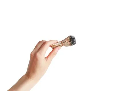 Hand holding herb bundle of dried sage smudge stick. Isolated image on white Stock Photos