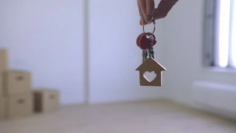 Hand Holding House Keys in Empty Space Stock Footage 313348621