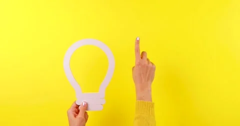 Hand Holding Idea Symbol with Index Finger Pointing Up Stock Footage 324955476