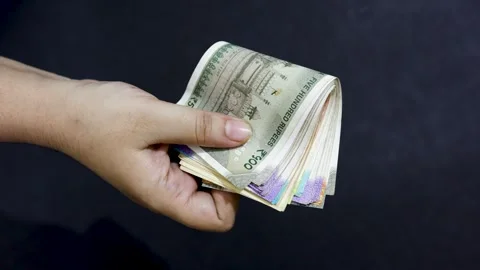 Hand holding Indian banknotes concept of social welfare and monetary indepe.. Stock Footage 318357399