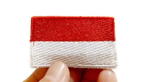 Hand Holding an Indonesian Flag Patch Stock Photos
