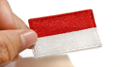 Hand Holding an Indonesian Flag Patch Stock Photos