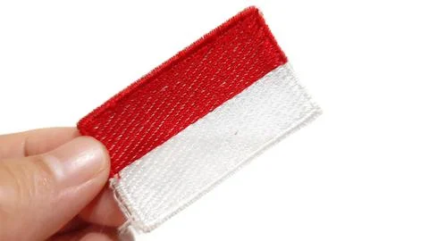 Hand Holding an Indonesian Flag Patch Stock Photos