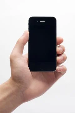 Hand holding iphone Stock Photos