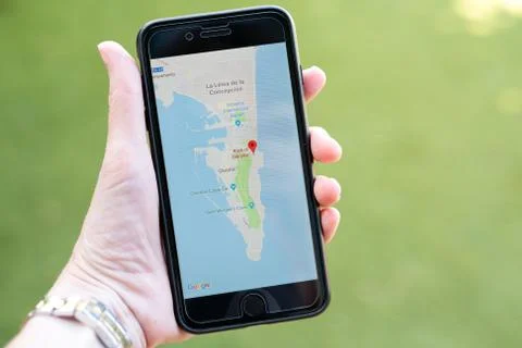 A hand holding an iphone Stock Photos