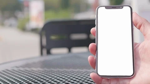 Hand Holding iPhone Smartphone, Isolated Stable Blank Screen Background Close Up Stock Footage 98962112
