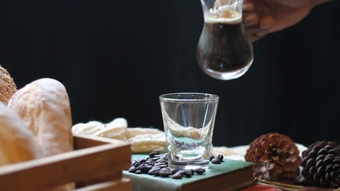 Hand holding jar and pour hot coffee into the cup. Stock Footage 100943348