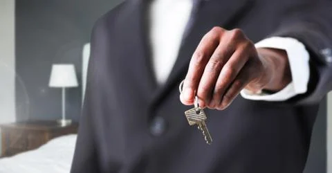 Hand Holding key  in bedroom Stock Photos