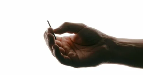 Hand Holding Key-Shaped Flash Drive on White Background Stock Footage 293676551