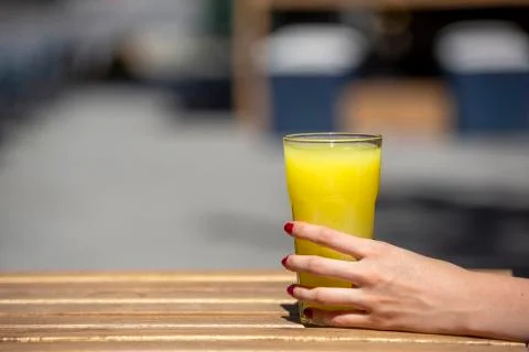 Hand holding lemonade, selective focus Stock Photos