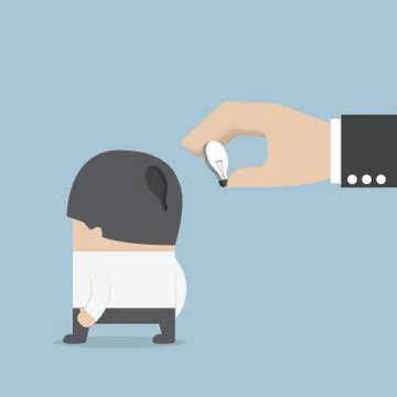 Hand holding light bulb of idea and input it into businessman head Stock Illustration