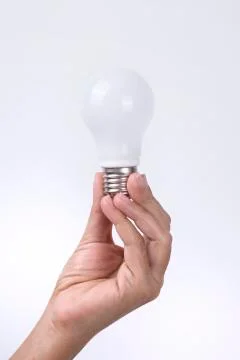 Hand Holding Light Bulb Stock Photos