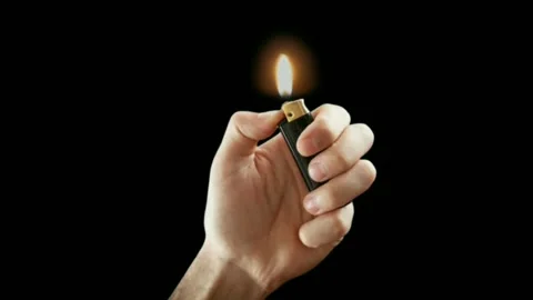Hand holding lighter black background stock video Stock Footage 275883119