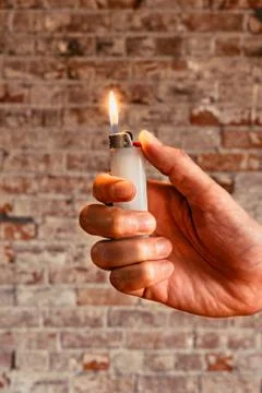 Hand holding a lighter Stock-Fotos