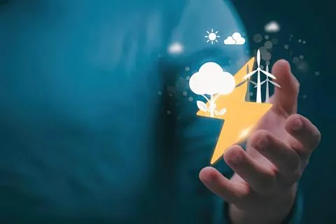 Hand holding lightning bolt with wind turbine and cloud scene Stock Photos