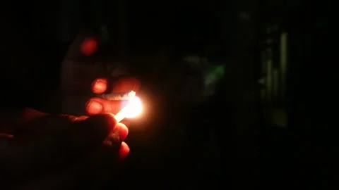 Hand Holding Lit Match Video stock 336682325