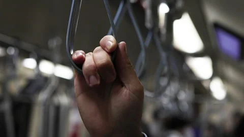 Hand holding on to loop in subway. Stock Footage 305773427